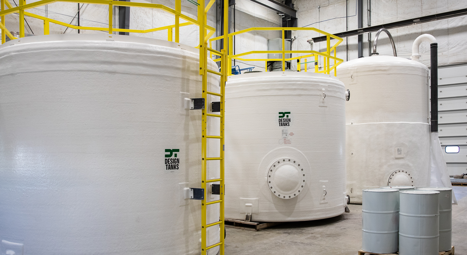 Three clean, white, fiberglass tanks.