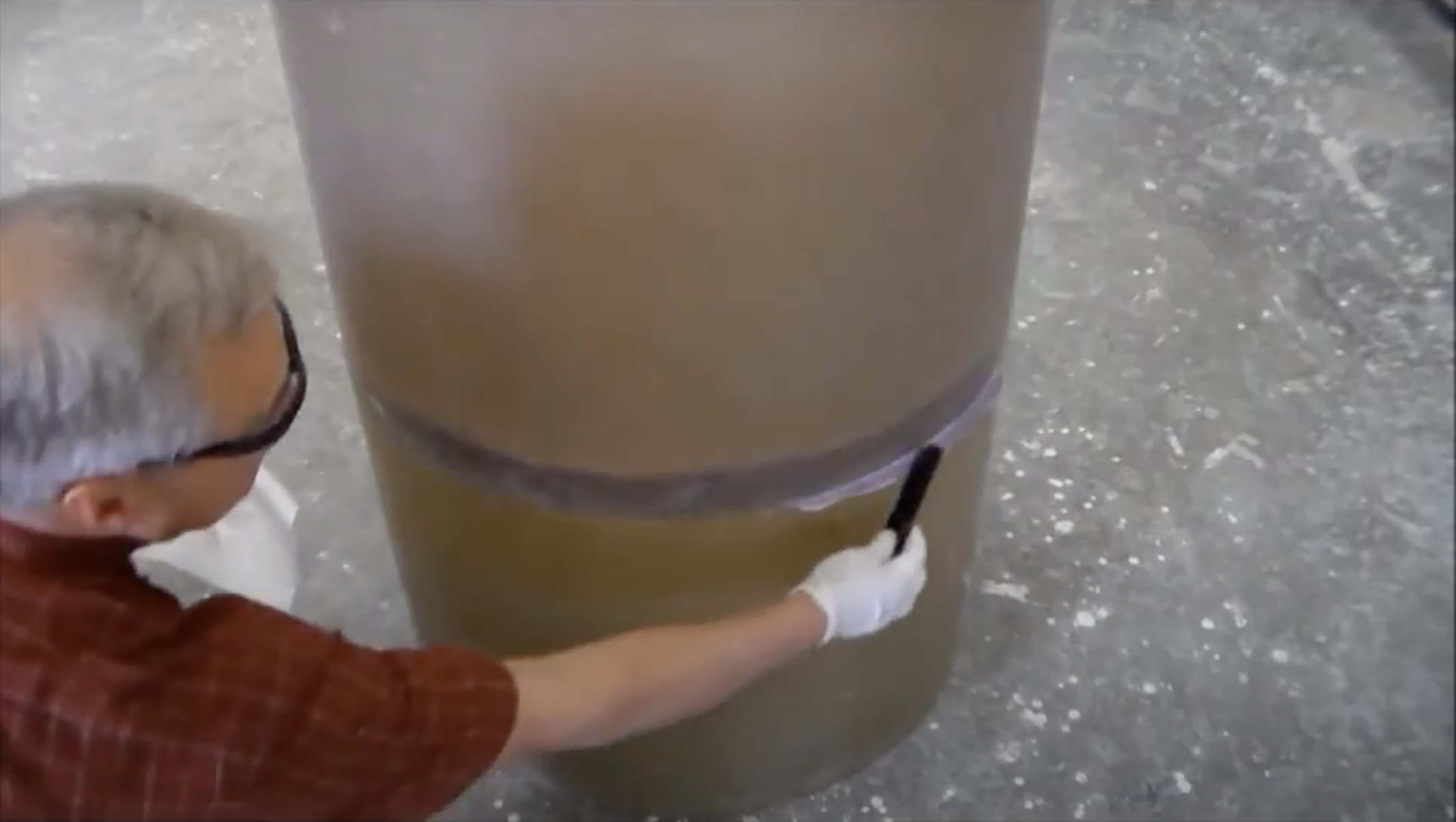 A design tanks employee demonstrates how to assemble a sectional tank