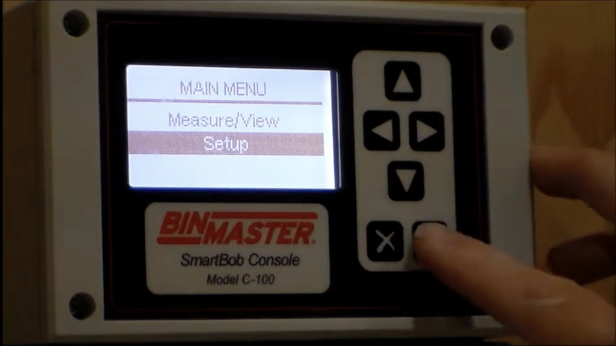 An employee demonstrates how to program a tank monitor